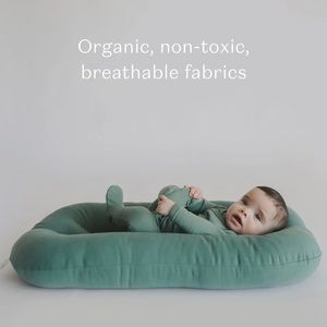 Snuggle me organic infant lounger in moss.